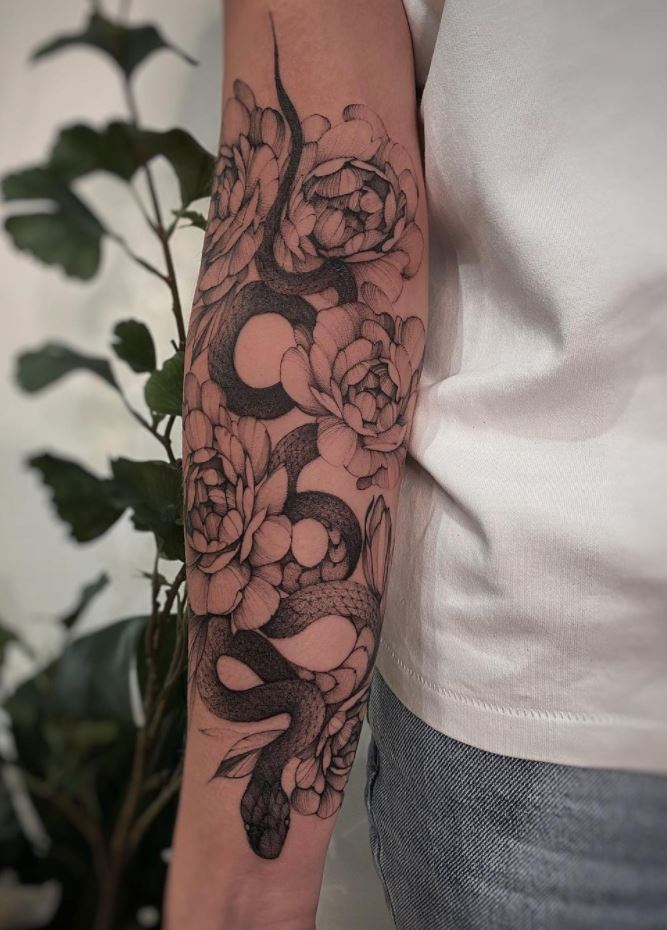 Snake In Flowers Tattoo